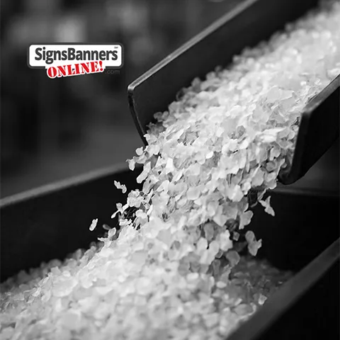 Plastic flakes floating down a recycling chute at the factory