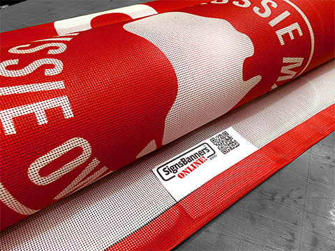 Signs Banners Online Logo Tag in the bonded hem of a tight weave mesh banner as product identification and QR code included.