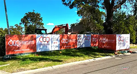 Image shows fence protection around a tree that is important during construction and use of heavy building equipment.