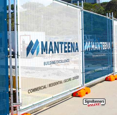 This excellent image shows how individual tradie banner style mesh banners are less disjointed on a long temporary construction site fence when the concrete stabilizer blocks are all parallel.