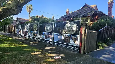 A popular discount tradie banner size is 2350 x 1800, reinforced edges all sides, eyelets all sides every 500mm apart.