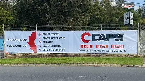 Sized to suit, this fence mesh banner was ordered exact size to match the premise chainlink fencing