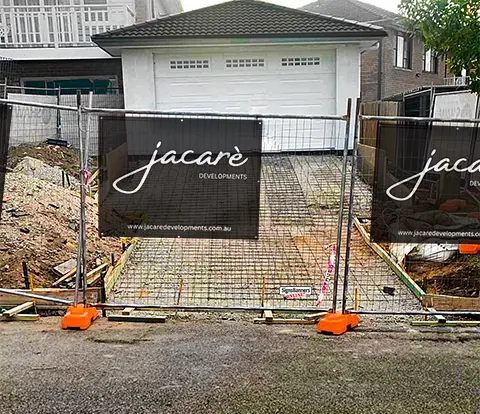 Onsite banner attached to the construction fence.