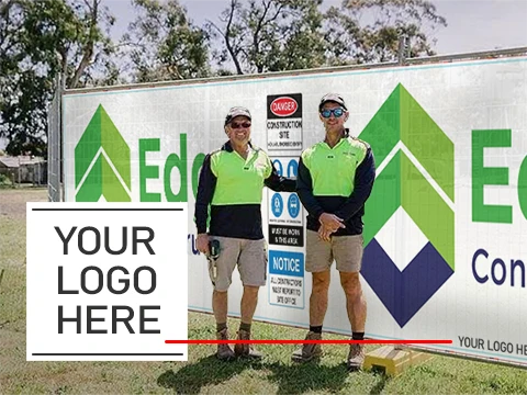 Website submitted photo of sign company workmen after installing colorful fence mesh wrapped on the site screen fencing.
