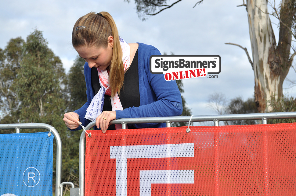 Event signage printing on the corner of the portable barricade being tied using a cable tie commonly known as Zip Tie.